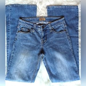 NWOT Stone Age medium wash distressed 5 pocket style flared leg denim jeans